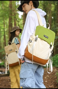 Detailed view of lightweight water-resistant hiking backpack with stylish color blocking