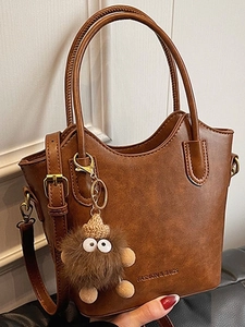 Women Retro PU Leather Bucket Bag Small Versatile Crossbody Shoulder Bag With Stitching Detail And Monster Pendant Accessories