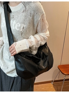 Chic black pleated faux leather crossbody bag for women in soft urban slouchy style