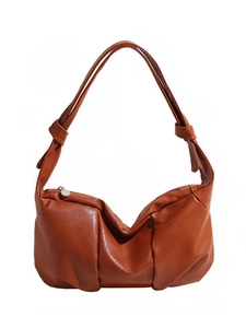 Minimalist caramel brown slouchy leather shoulder bag with knotted strap details