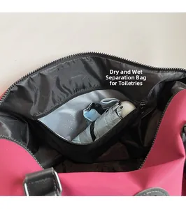 Detail of the pink travel bag featuring a waterproof wet-dry separation pocket for umbrellas