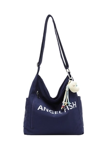 Large navy blue nylon hobo bag with Angel Fish print and cute plush charm on white background