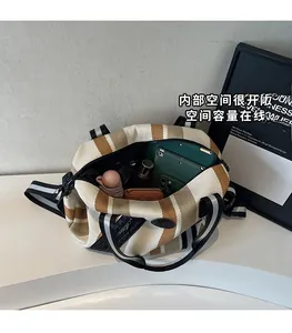 Top view of striped canvas tote bag interior showing spacious storage for essentials