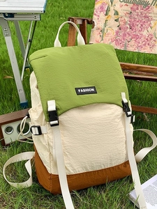 Waterproof outdoor backpack in green white and brown colors for hiking and travel