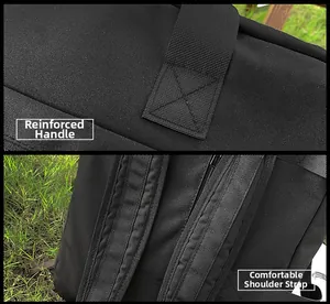 Detail of reinforced handle stitching and padded shoulder straps on the black travel bag