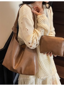 Brown faux leather tote bag and pouch set with knot shoulder strap on model