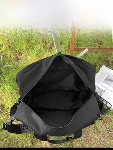 Spacious interior of a large black travel canvas bag showing wide storage capacity