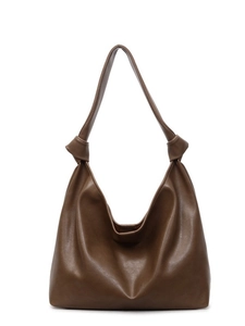 Brown leather tote bag with unique knotted strap detail and soft slouchy silhouette