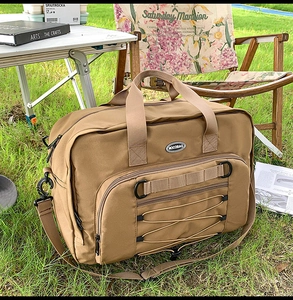 Detail of durable brown canvas travel bag with elastic cord and adjustable shoulder strap