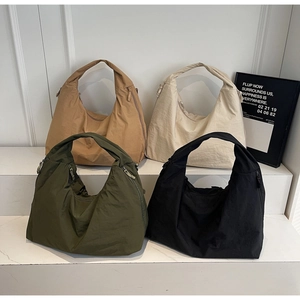 Comparison of four casual canvas tote bags in khaki, cream, green and black colors