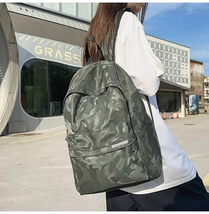 Outdoor shot of a durable camouflage backpack with a spacious main compartment for travel