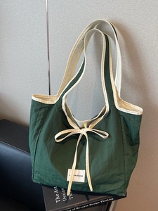 Deep green versatile tote bag with beige bow and LOVE MORNING label for daily commute