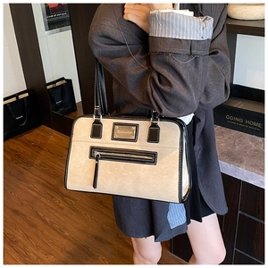 Business style tote bag with contrast lace bow and front zipper pocket on model