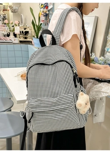 Sac à dos classique en toile à carreaux noir et blanc avec joli pendentif étoile en peluche