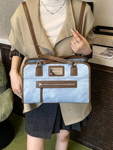 Blue bow lace tote bag with brown leather trim and shoulder strap for women