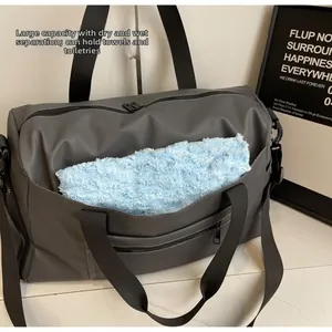 Detail view of the waterproof gym bag featuring a dedicated wet and dry separation pocket