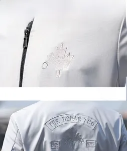 Close-up of maple leaf and Canada embroidery on a gray slim-fit casual baseball jacket