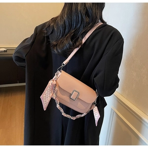 Pink crossbody bag featuring crocodile texture, silver metal buckle and silk scarf chain strap