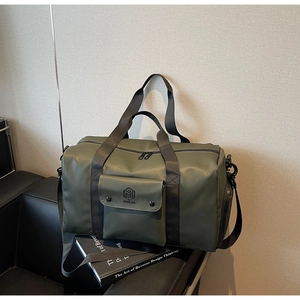 Close-up of olive green fitness bag with durable texture and front logo pocket
