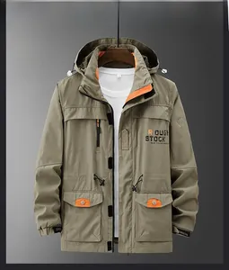 Detail of khaki hooded utility jacket with chest zipper and orange lining accent