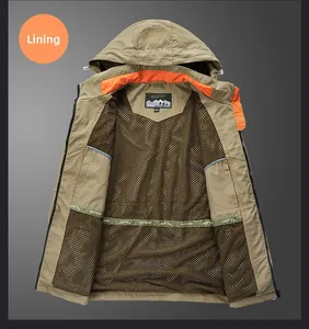 Detail view of khaki outdoor jacket showing brown mesh lining and orange accents