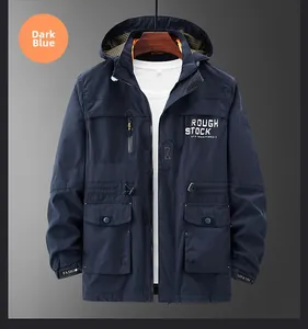 Detail view of navy blue hooded utility jacket with front pockets and rough stock embroidery