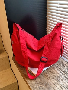 Red large capacity nylon hobo bag with adjustable strap and small coin purse attached