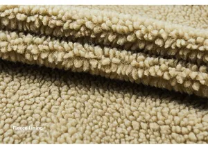 Detail of warm camel fleece lining for winter jacket showing soft thick texture