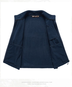 Detail showing functional inner pockets of the dark blue fleece vest with a stand collar