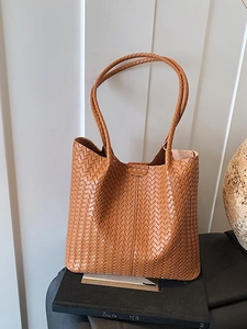 Vintage brown woven leather tote bag with elegant V-pattern texture and top handles