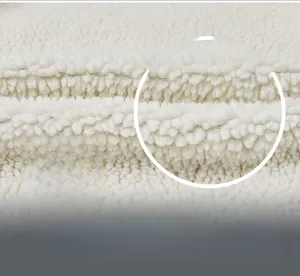 Detail of the warm fleece lining with dense sheepskin-like texture for thermal winter jackets
