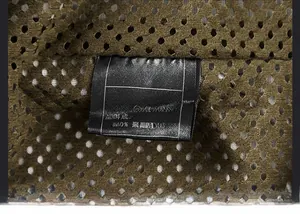 Detailed view of wash care label showing 100% polyester lining and nylon fabric