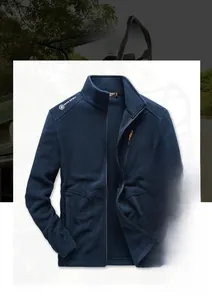 Detail of dark blue fleece jacket showing stand collar and peak spirit shoulder logo