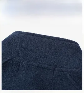 Close-up of deep blue fleece fabric back detailing and precision stitching for vest