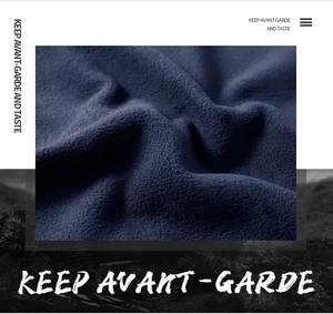 Detailed macro view of dark blue polar fleece fabric texture showing soft dense fibers