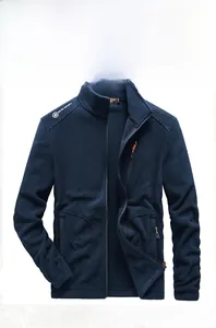 Detailed view of men's navy blue fleece jacket with high collar and chest zipper pocket