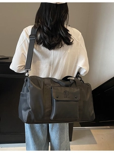 Large black gym bag for men and women with adjustable shoulder strap and spacious storage