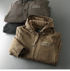 Detail of three heavy cotton work jackets showing plush sherpa lining and embroidery