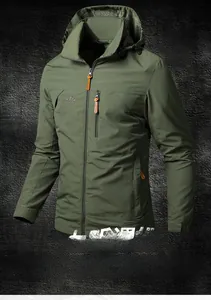 Detail of olive green hooded jacket featuring outdoor embroidery and windproof fabric