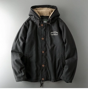 Detailed close-up of heavy dark grey workwear jacket with thick faux shearling lining