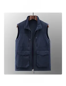 Detail of navy blue polar fleece vest showing outdoor logo and functional zipper pockets