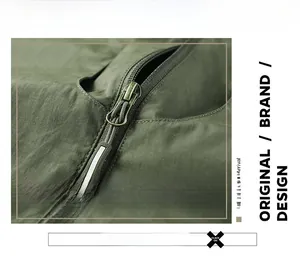 Macro detail of retro metal zipper and durable ripstop fabric on olive outdoor vest