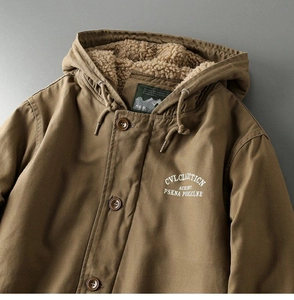 Detail of hooded parka with warm faux shearling lining and vintage brown buttons