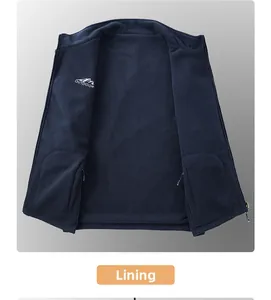 Detail of fleece lining and embroidered logo on dark blue winter outdoor vest