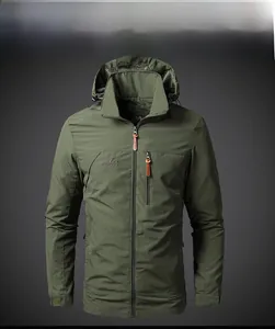 Close-up of army green tactical jacket featuring outdoor embroidery and velcro cuffs