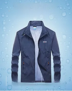 Detail of breathable navy blue sun protection jacket with elastic cuffs and outdoor logo