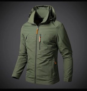 Detail of army green outdoor jacket featuring chest zipper pocket and mountain logo