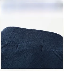 Detailed back view showing premium stitching and thick fleece texture on dark blue jacket