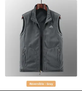Detail of grey outdoor fleece vest featuring zipper pockets and mountain logo embroidery