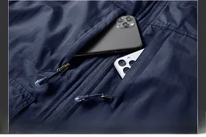 Detail shot of navy polar fleece vest showing large functional chest pockets for storage